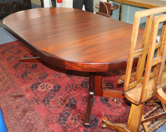 Kofod Larsen for Faarup Mobelfabrik, Denmark, a rosewood-veneered extending dining table, L 220cm (max) W 120cm